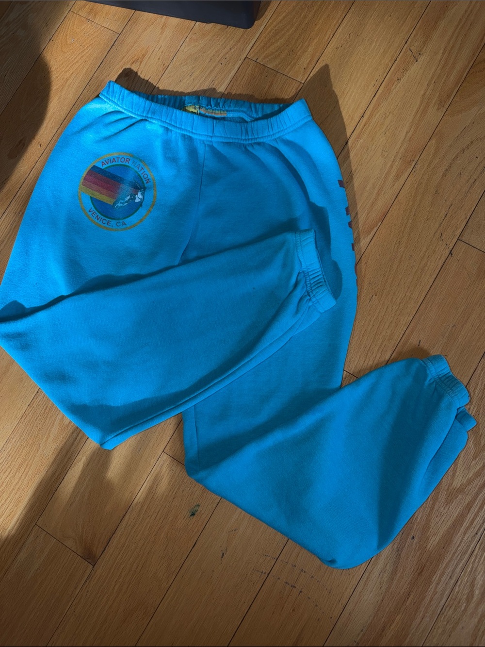 Aviator Nation Teal Blue Women’s Joggers with Rainbow Patch